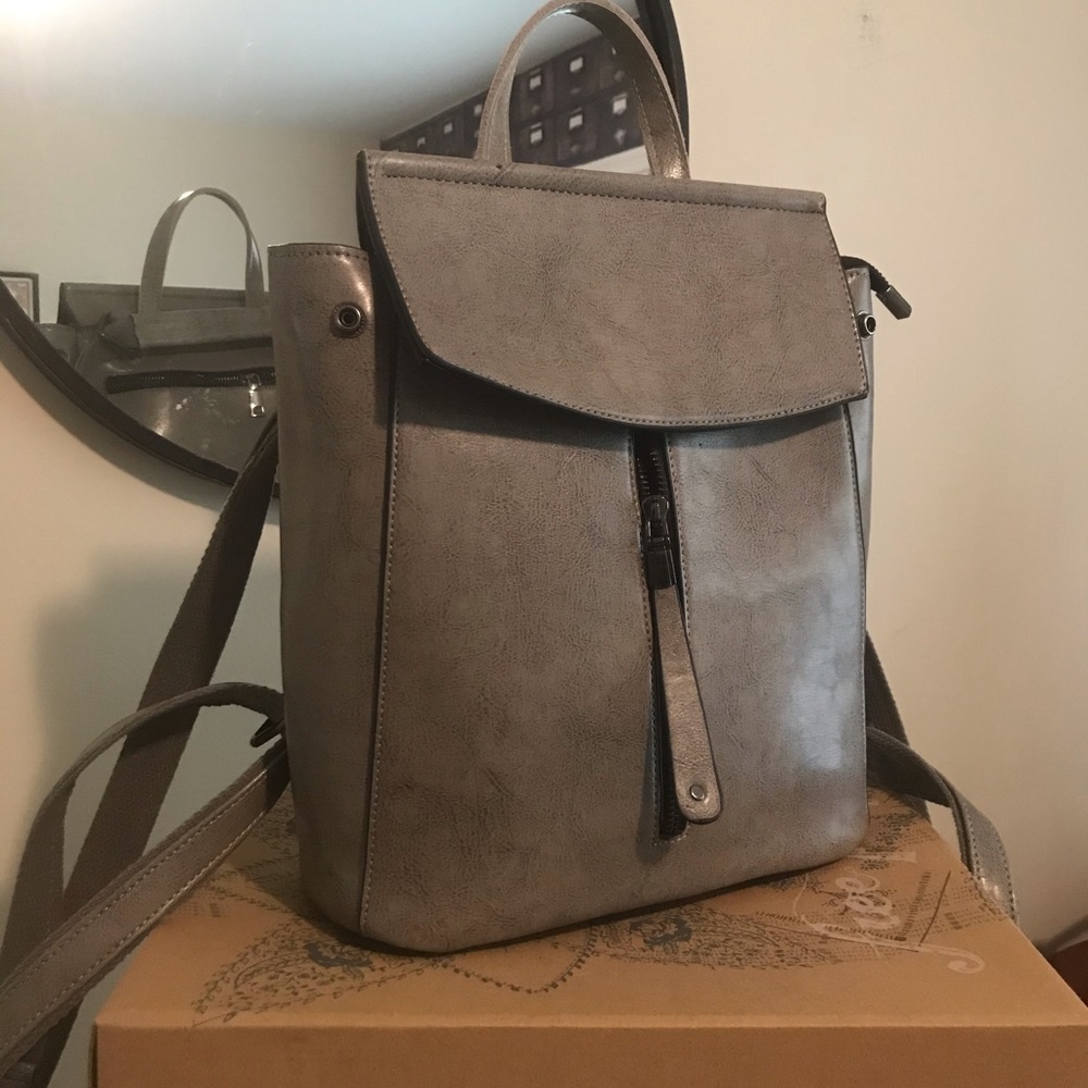 Leather backpack with black zippers